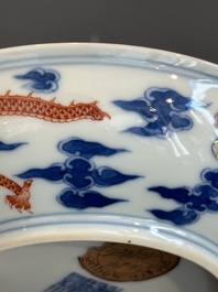 An imperial Chinese blue, white and iron-red 'dragon' plate, Qianlong mark and of the period