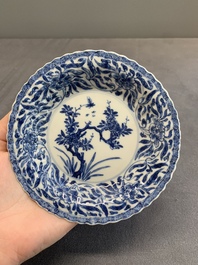 Twelve Chinese blue and white saucers and eight cups, Kangxi/Yongzheng