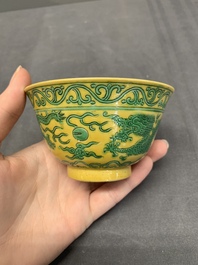 A pair of Chinese yellow-ground 'dragon' and 'shou' bowls, Guangxu mark and of the period