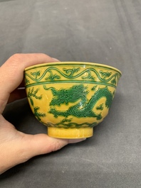 A pair of Chinese yellow-ground 'dragon' and 'shou' bowls, Guangxu mark and of the period