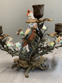 A pair of candle holders mounted with Chinese famille rose models of pheasants, Qianlong