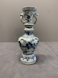 A pair of Chinese blue and white handled vases with floral design, Ming