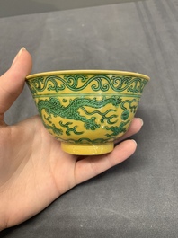 A pair of Chinese yellow-ground 'dragon' and 'shou' bowls, Guangxu mark and of the period