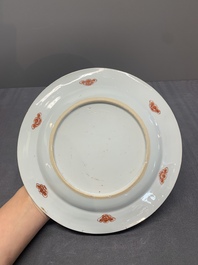 Two Chinese famille rose plates and an Imari-style armorial plate, Kangxi/Yongzheng