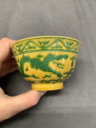 A pair of Chinese yellow-ground 'dragon' and 'shou' bowls, Guangxu mark and of the period