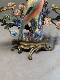 A pair of candle holders mounted with Chinese famille rose models of pheasants, Qianlong