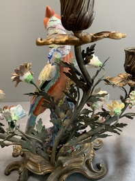 A pair of candle holders mounted with Chinese famille rose models of pheasants, Qianlong
