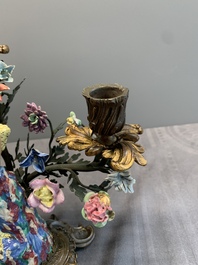 A pair of candle holders mounted with Chinese famille rose models of pheasants, Qianlong