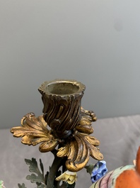 A pair of candle holders mounted with Chinese famille rose models of pheasants, Qianlong