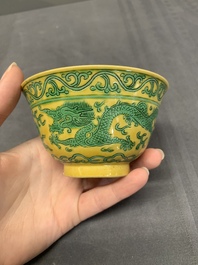 A pair of Chinese yellow-ground 'dragon' and 'shou' bowls, Guangxu mark and of the period