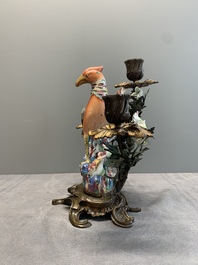 A pair of candle holders mounted with Chinese famille rose models of pheasants, Qianlong