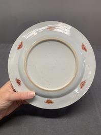 Two Chinese famille rose plates and an Imari-style armorial plate, Kangxi/Yongzheng