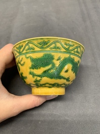 A pair of Chinese yellow-ground 'dragon' and 'shou' bowls, Guangxu mark and of the period