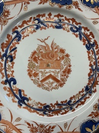 Two Chinese famille rose plates and an Imari-style armorial plate, Kangxi/Yongzheng