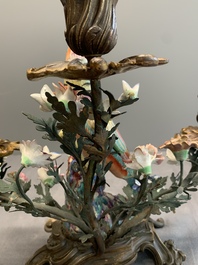 A pair of candle holders mounted with Chinese famille rose models of pheasants, Qianlong