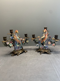 A pair of candle holders mounted with Chinese famille rose models of pheasants, Qianlong