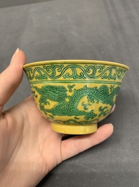 A pair of Chinese yellow-ground 'dragon' and 'shou' bowls, Guangxu mark and of the period