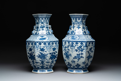 A pair of Chinese blue and white octagonal vases with floral design, 19th C.