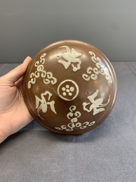 A Chinese slip-decorated brown-glazed 'three friends of winter' bowl and cover, Zhushan kilns, late Ming
