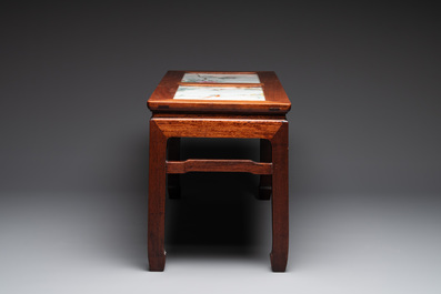 A Chinese hardwood low table with two famille rose plaques, Republic