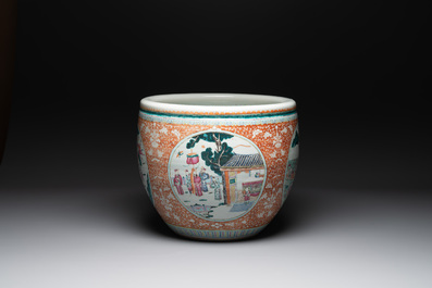 A large Chinese famille rose coral-red-ground fish bowl with narrative design, 19th C.