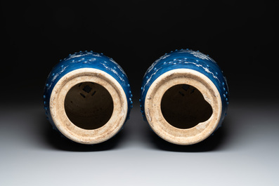 A pair of Chinese white slip-decorated blue-ground garden seats, 19th C.