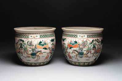 A pair of Chinese Nanking famille verte 'warriors' fish bowls, 19th C.