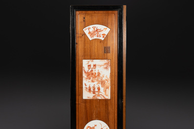 A Chinese four-part folding screen with iron-red-decorated porcelain plaques, 19/20th C.