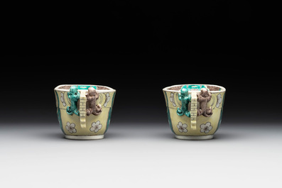 A pair of fine Chinese sancai-glazed 'Buddhist lion and chilong' libation cups, Kangxi