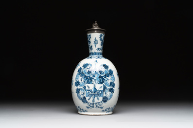 A Dutch Delft blue and white pewter-mounted armorial jug, late 17th C.
