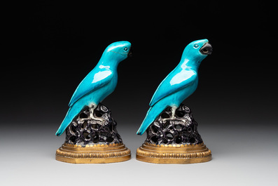 A pair of turquoise- and aubergine-glazed parrots with gilt bronze mounts, Kangxi
