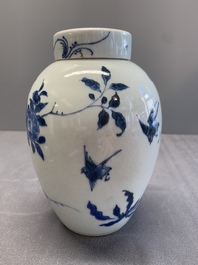 A Chinese blue and white jar and cover with birds among flowering branches, Transitional period