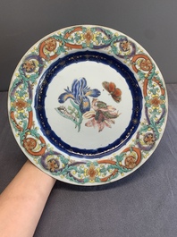 A pair of Chinese famille rose 'botanical' plates after Maria Sybilla Merian, Qianlong