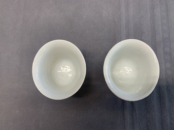 A pair of Chinese Dehua blanc de Chine relief-decorated famille rose 'prunus' cups, 19th C.