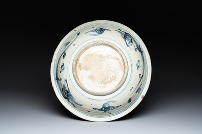 A Chinese Swatow blue and white dish with stylised floral design, Ming