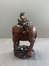 A pair of Chinese carved bamboo groups of a boy riding a buffalo, 19/20th C.