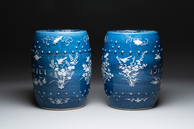 A pair of Chinese white slip-decorated blue-ground garden seats, 19th C.