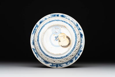 A Chinese blue and white reticulated double-walled cup and saucer, lingzhi mark, Kangxi
