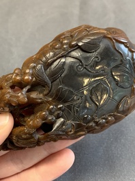 A rare Chinese carved rhinoceros horn 'libation cup' with grape design, 17/18th C.