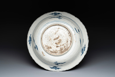 A Chinese Swatow blue and white dish with deer in a landscape, Ming