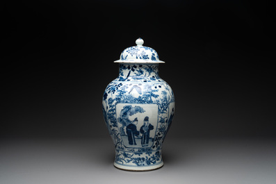 A pair of Chinese blue and white vases and covers with figural panels, 19th C.