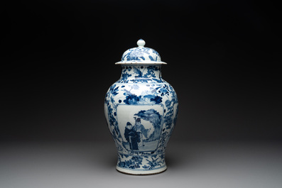 A pair of Chinese blue and white vases and covers with figural panels, 19th C.