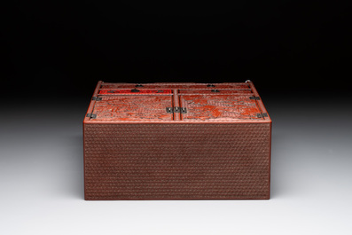 A Chinese cinnabar lacquer 'mountainous landscape' cabinet, 19th C.