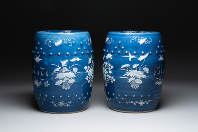 A pair of Chinese white slip-decorated blue-ground garden seats, 19th C.