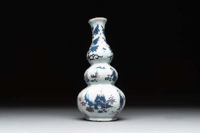 A Dutch Delft blue, white and manganese chinoiserie triple gourd vase, late 17th C.