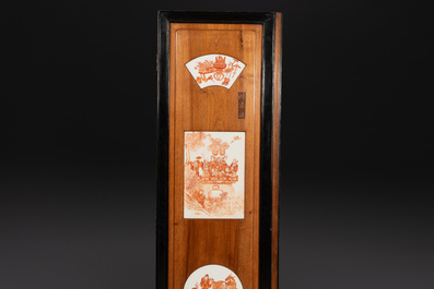 A Chinese four-part folding screen with iron-red-decorated porcelain plaques, 19/20th C.