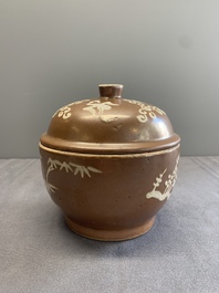 A Chinese slip-decorated brown-glazed 'three friends of winter' bowl and cover, Zhushan kilns, late Ming