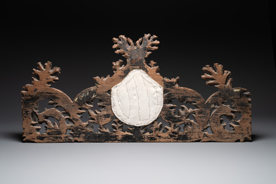 Two ornately carved decorative panels and a niche with an embroidered scene, France, 16/18th C.