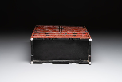 A Chinese cinnabar lacquer 'mountainous landscape' cabinet, 19th C.