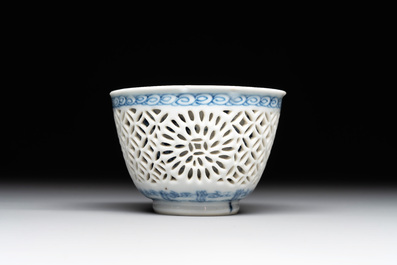 A Chinese blue and white reticulated double-walled cup and saucer, lingzhi mark, Kangxi